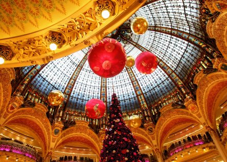 Christmas tree with decorations and lights in department store Galeries Lafayette in Paris