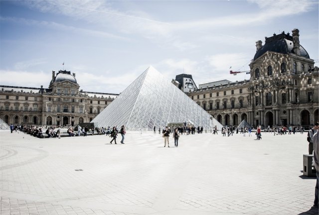 The Louvre Museum's glass pyramid in the snow in Paris