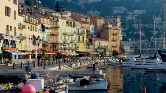 Pastel colored buildings along the waterfront of Nice France