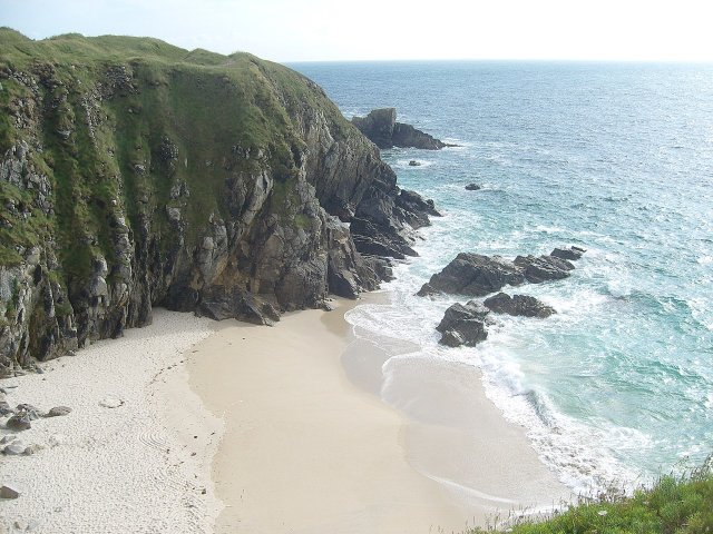 View of white sand and sea of Plougonvelin beach in Brittany from the cliff-top