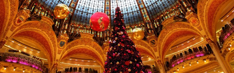 Christmas tree with decorations and lights in department store Galeries Lafayette in Paris