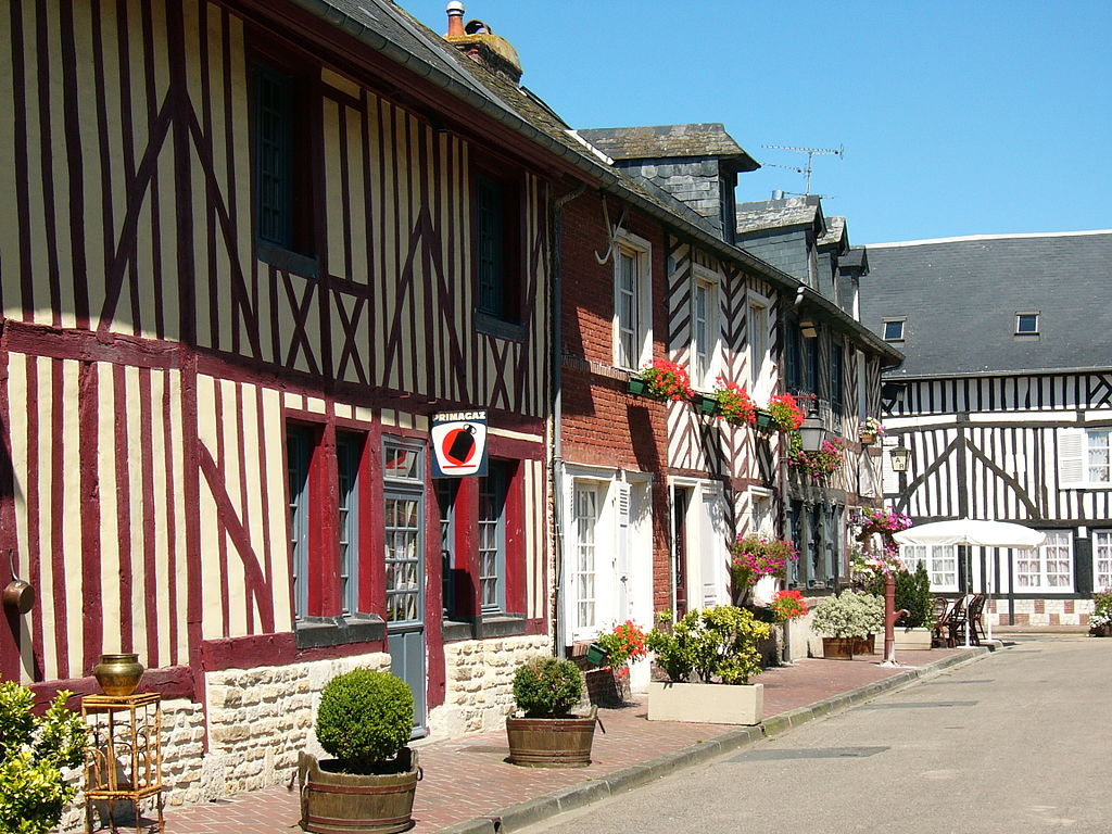 Red and white half-timbered house in the village of Beuvron-en-Auge in Normandy