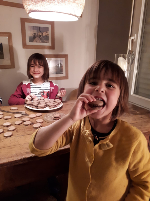 Jeanne and Pauline enjoying French chocolate macarons