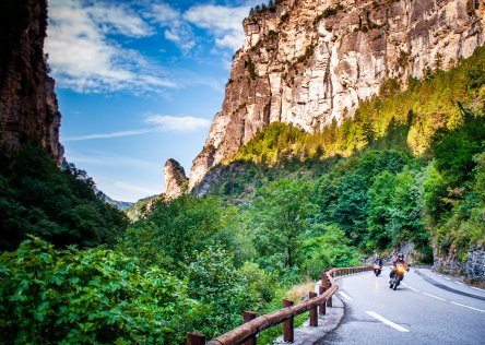 Motorcycles on the road in France, riding by the Gorges de Daluis