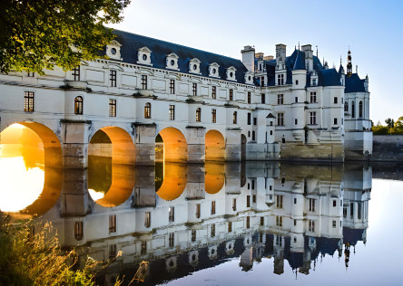 Chenonceau castle with its grand arches over the Loire Valley River