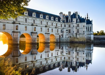 Chenonceau castle with its grand arches over the Loire Valley River