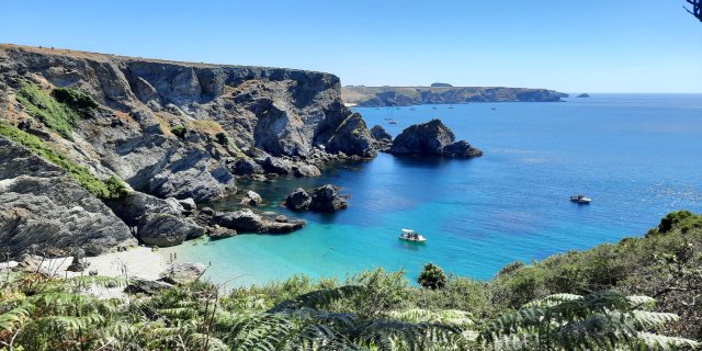 Cliff-top view from Belle Ile off the coast of Brittany. The sea is a deep blue-green and the sand is white