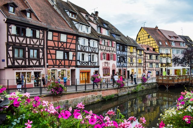 Colorful, half-timbered houses next to the canal in Colmar, Alsace Colorful, half-timbered houses next to the canal in Colmar, Alsace