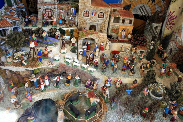 Handcrafted santons in a Nativity scene in Provence at Christmas Nativity scene with many figurine villagers - a typical Provence village Christmas scene