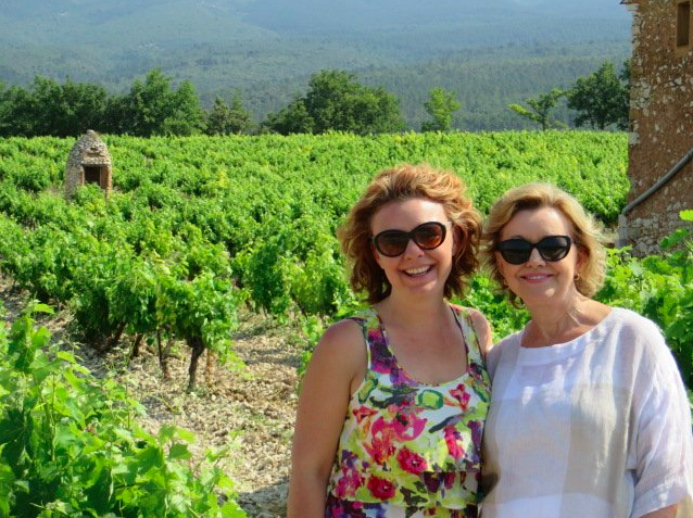 Traveler DeLana and her Mom visiting a French vineyard