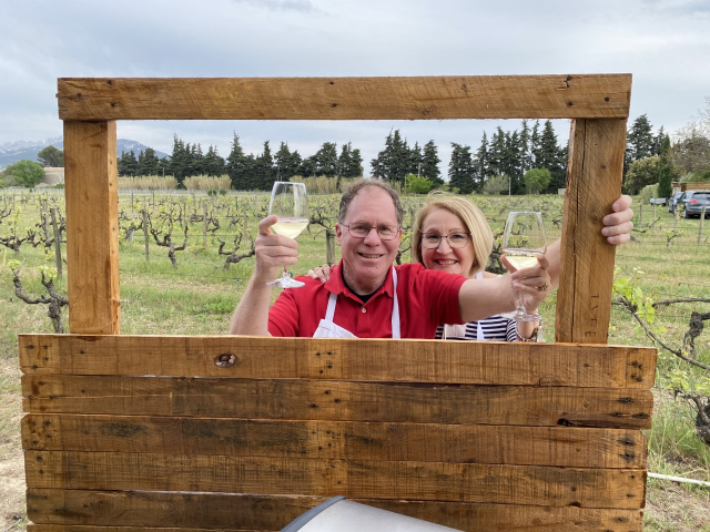 Travelers Diana and Michael pictured in Chef Benoit's vineyard, enjoying a glass of wine Travelers Diana and Michael pictured in Chef Benoit's vineyard, enjoying a glass of wine