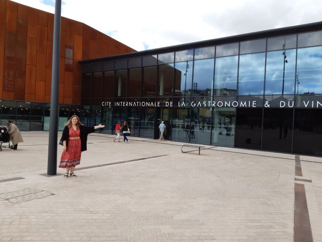 Our trip planner Laura outside the Cite of Gastronomy and Wine in Dijon