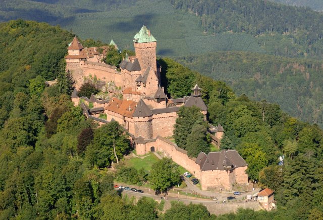 Haut-Koenigsbourg Castle in Alsace viewed from above surrounded by green forest