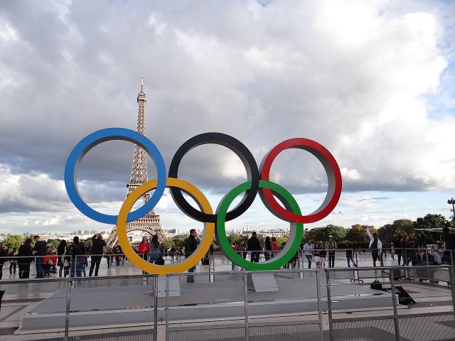 The five Olympic rings in Paris with the Eiffel Tower in the background