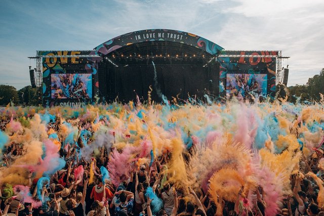 Solidays Festival, France. The stage is in the background and the audience is wearing bright colors.