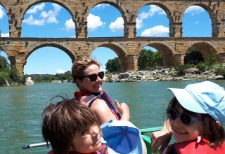 FJFY Founder Emilie and her daughters kayaking at the Pont du Gard in Provence