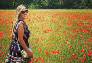 Traveler Martina in a poppy field in Provence