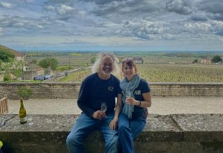 Travelers Bev & Jeff at a wine-tasting in Burgundy