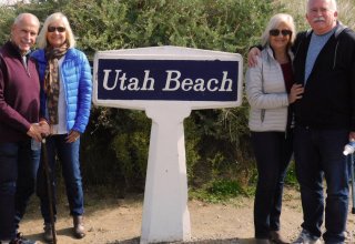 Travelers Kathy, Keith, Rose and Bryan at Utah beach in Normandy