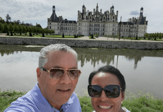 Travelers Eugene & Laura in front of Chambord Castle in the Loire Valley