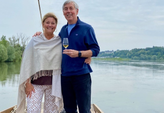 Travelers Lisa and Don enjoying a wine-tasting on a traditional boat in the Loire Valley Travelers Lisa and Don enjoying a wine-tasting on a traditional boat in the Loire Valley