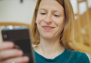 The MyFrance app will contain your itinerary and link up with your phone's GPS app A woman looking at the MyFrance app on her phone