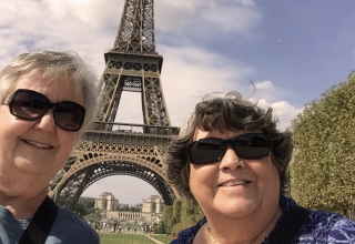 Travelers Ruth and Mary-Ann from the USA by the Eiffel Tower in Paris Travelers Ruth and Mary-Ann from the USA by the Eiffel Tower in Paris