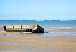 Remains of the Mulberry port - you can tell how big this is compared to the kid Remains of the Mulberry port - you can tell how big this is compared to the kid ©CRT Normandy