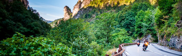 Motorcycles on the road in France, riding by the Gorges de Daluis