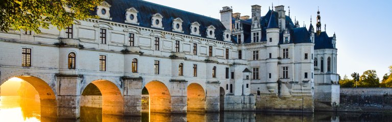 Chenonceau castle with its grand arches over the Loire Valley River