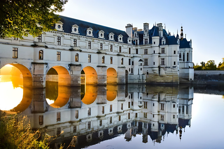 Chenonceau castle with its grand arches over the Loire Valley River