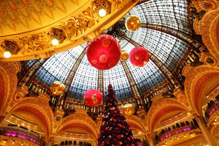 Christmas tree with decorations and lights in department store Galeries Lafayette in Paris