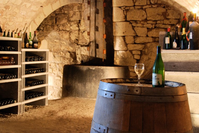 A wine cellar with bottles of wine