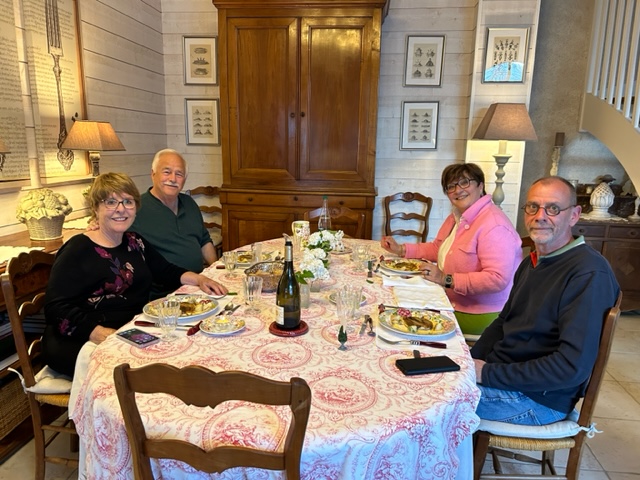 Travelers Kathy & Steve dining with fellow travelers in their B&B in the Loire Valley