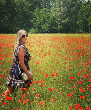 Traveler Martina in a field of poppies in Provence