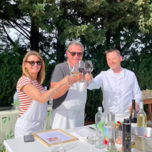 Travelers Matthew & Georgia from Australia enjoying some wine during a cooking class with Chef Benoit