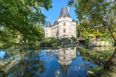 Chateau de l'Islette in the Loire Valley. You can see reflections in the lake and the castle is framed by trees